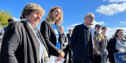 Randi with group on bus tour stop