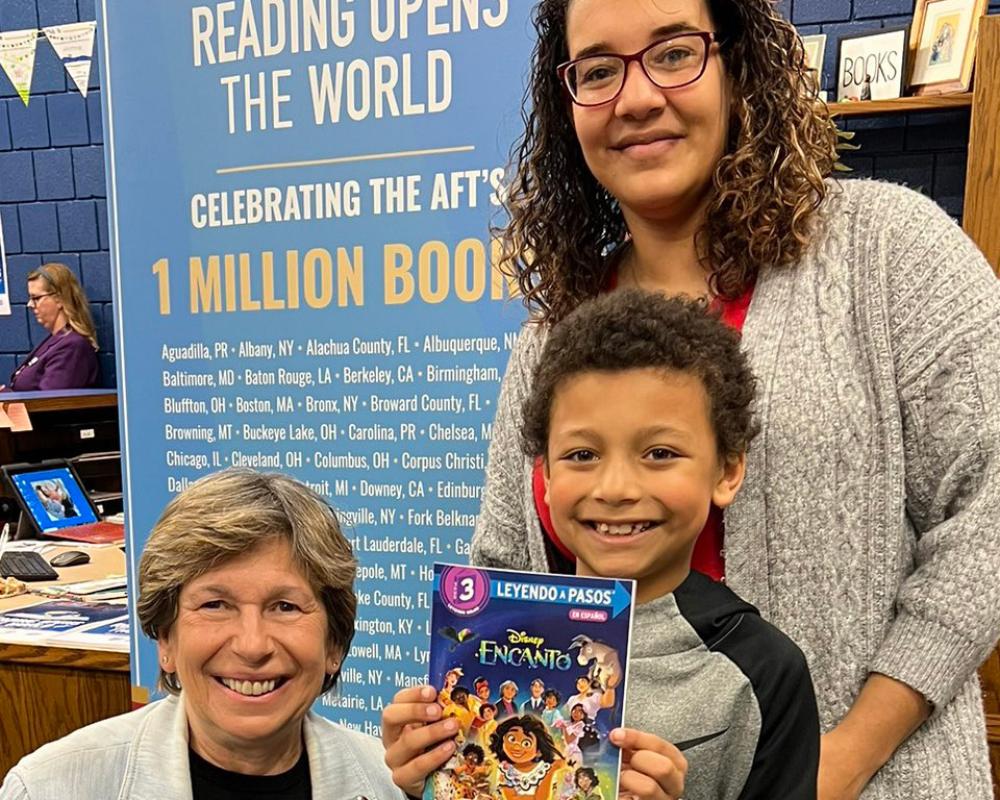 Photo: Jayveon, a 3rd grader at Cloud Elementary with his mother, Victorya and AFT President Randi Weingarten at a Reading Opens the World event with AFT Kansas and United Teachers of Wichita.