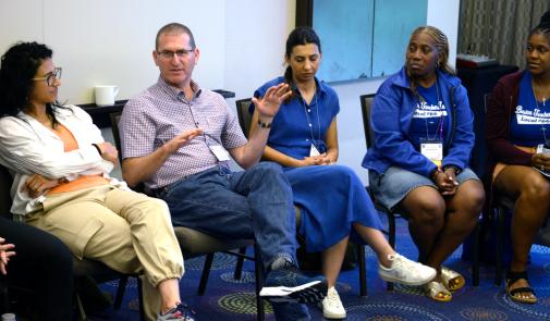 Participants talk during the Individual and Collective Identity (Hand in Hand) workshop