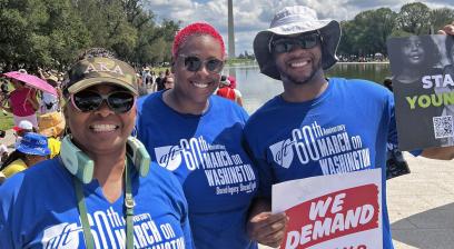 Photo of three Washington Teachers' Union members posing together at the march.