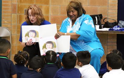 Lorretta reads to children