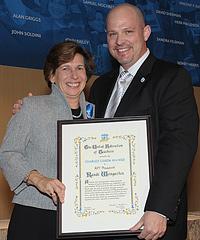 Randi Weingarten receives the Charles Cogen Award from UFT president Michael Mulgrew. Photo by Miller Photography.