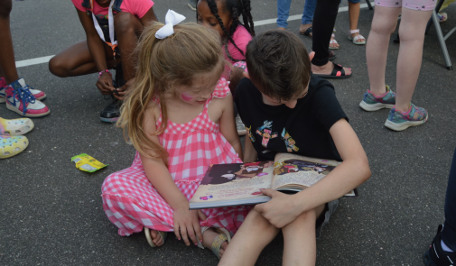 Photo of children reading together at a ROTW event in Sachem, NY